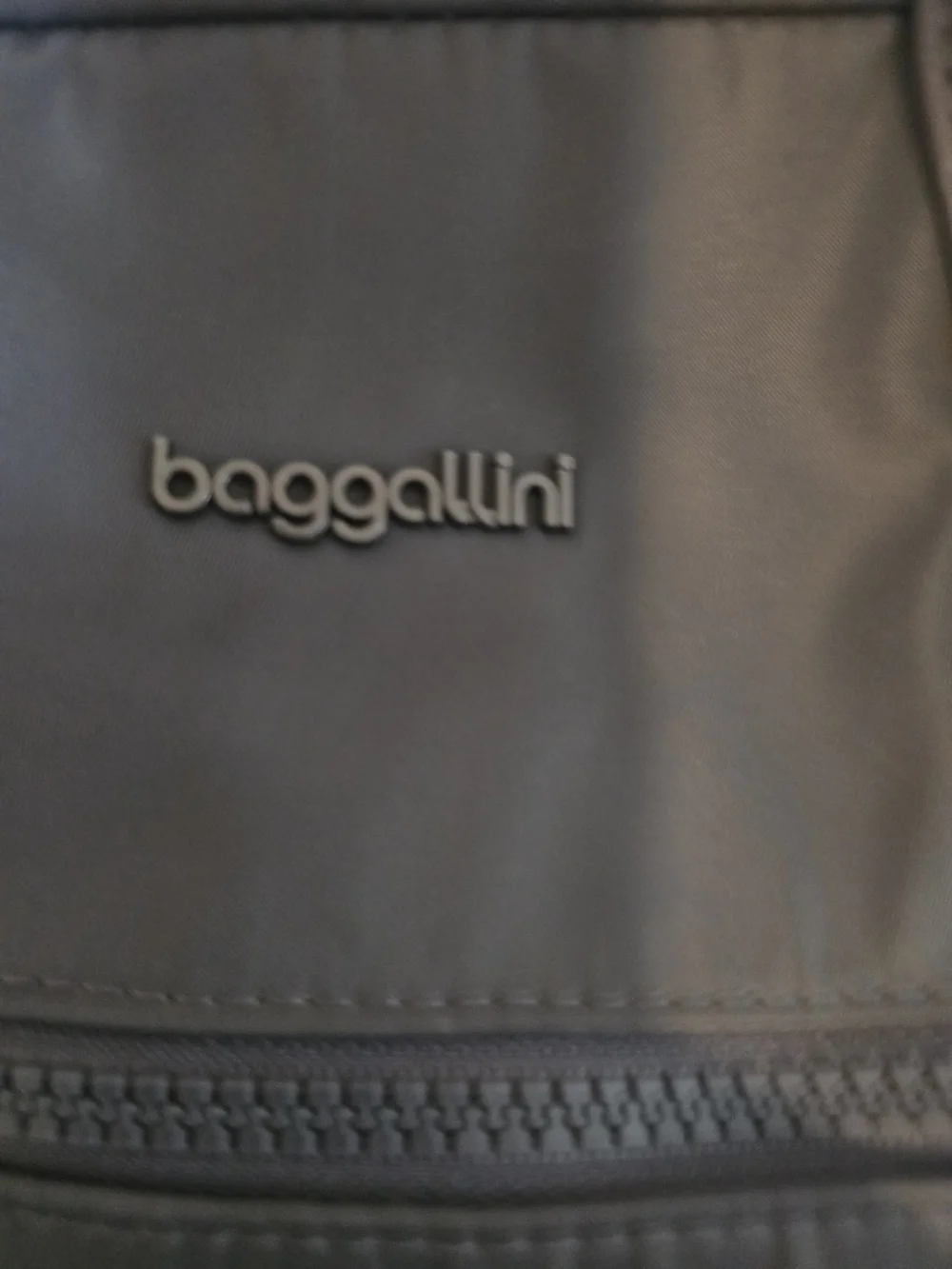 Baggallini Expandable Travel Backpack / Tote Bag – Gray Description: Lightly use